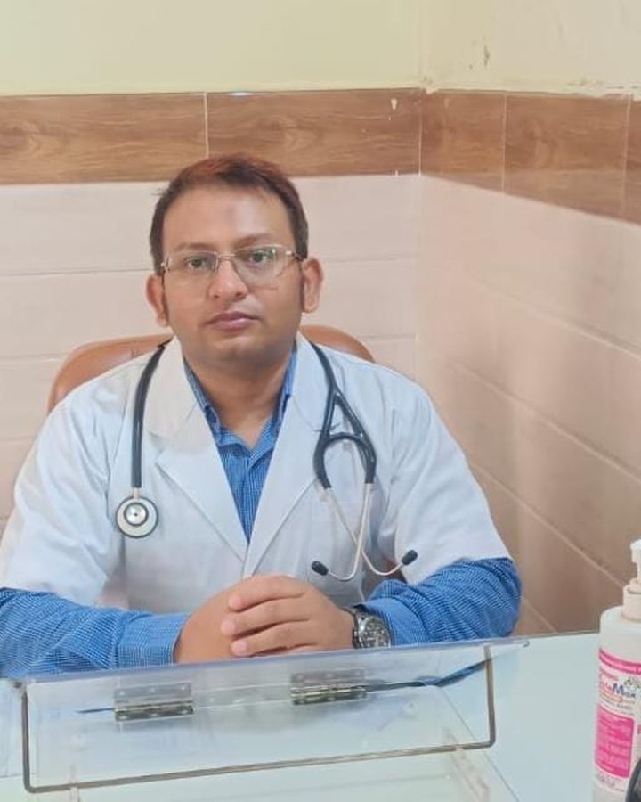 Dr. Sarfaraz Ahmed at his consulting desk at Perfect Medical Centre